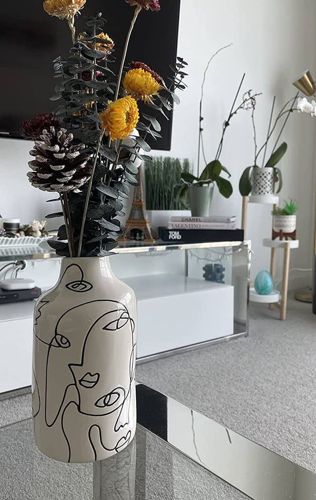 Reviewer's vase holding some dried flowers on a living room table
