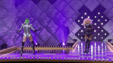 two drag queens dancing and doing back bends