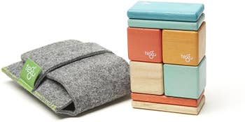 a gray pouch and colorful wood blocks
