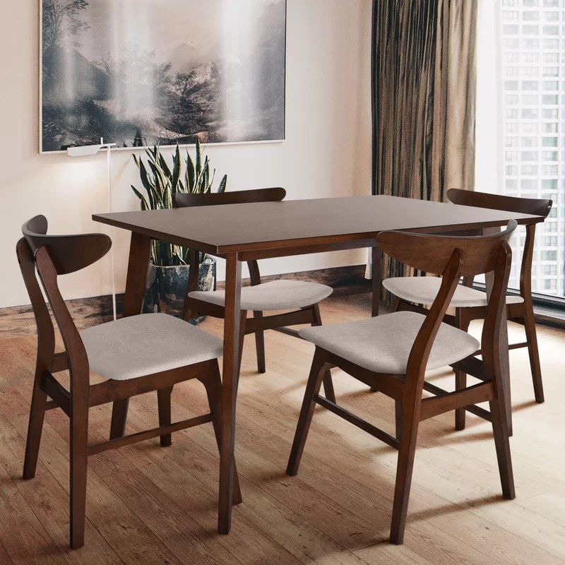 The table and chairs in beige in a dining area