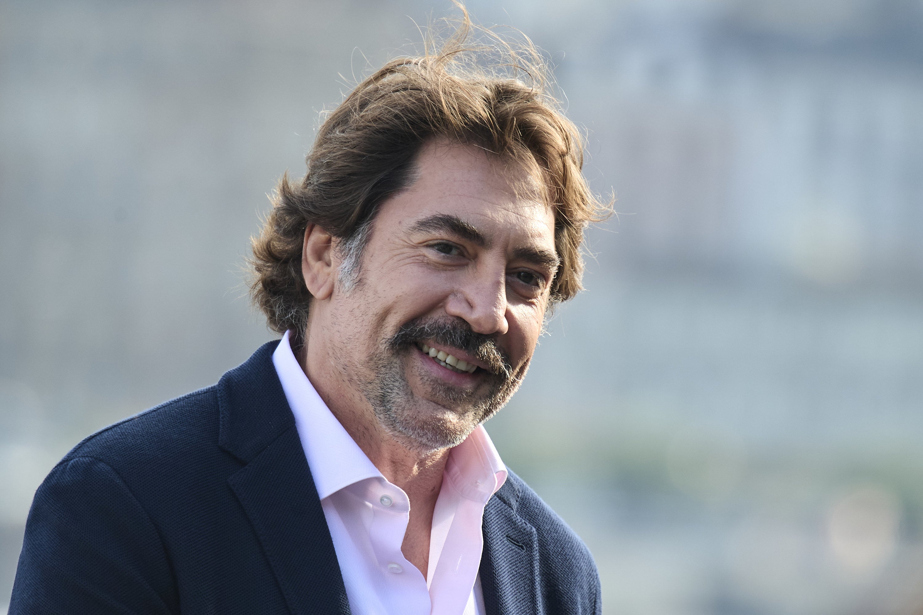 Javier Bardem tilting his head and smiling