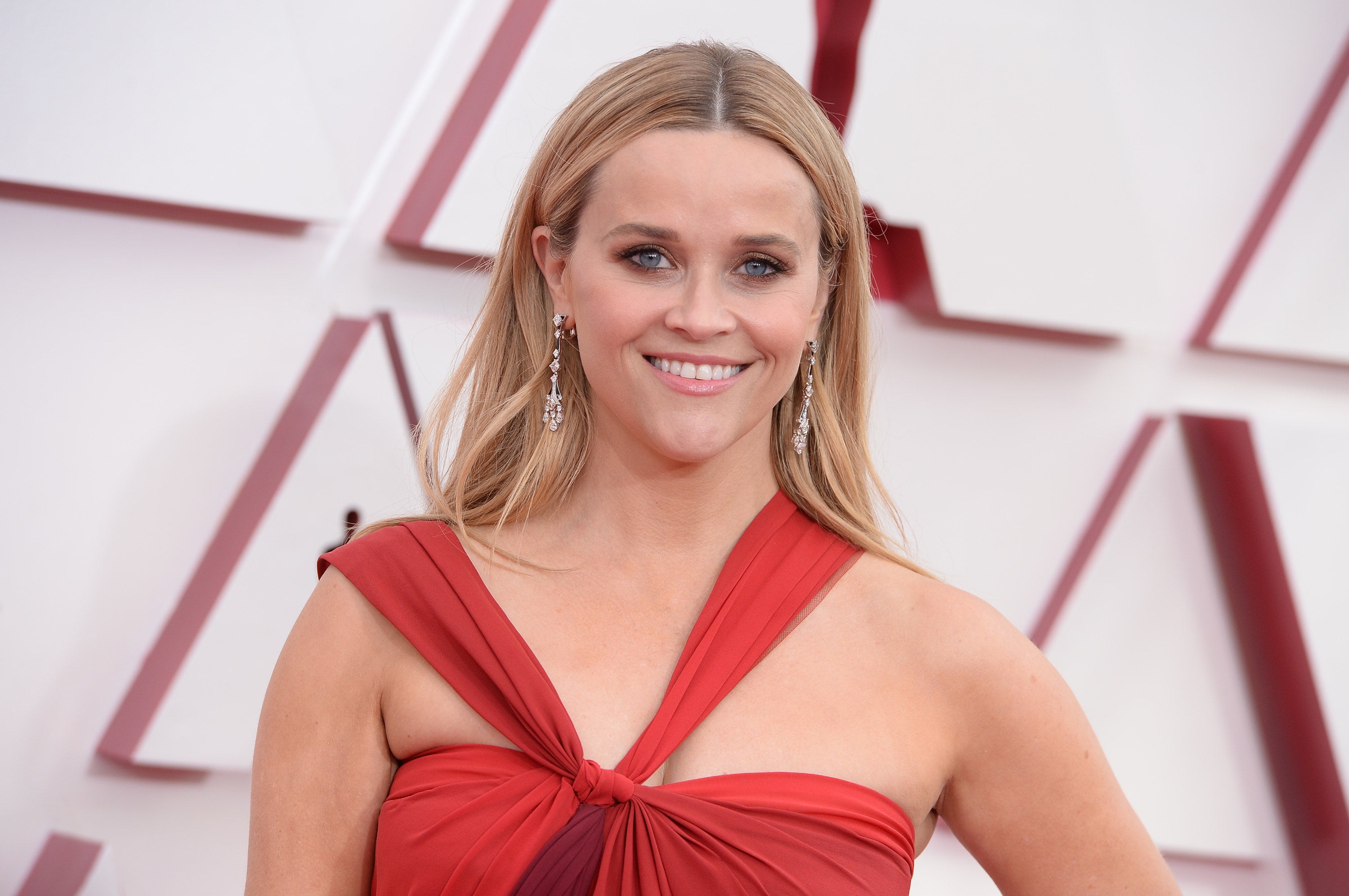 Reese looking into camera with a huge smile on her face