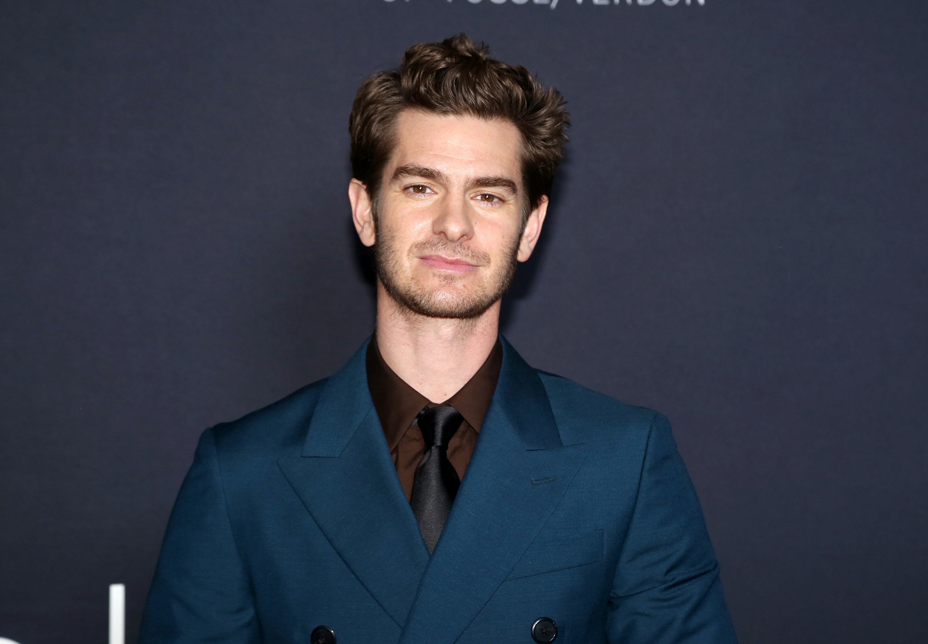 Andrew Garfield looking at the camera smiling
