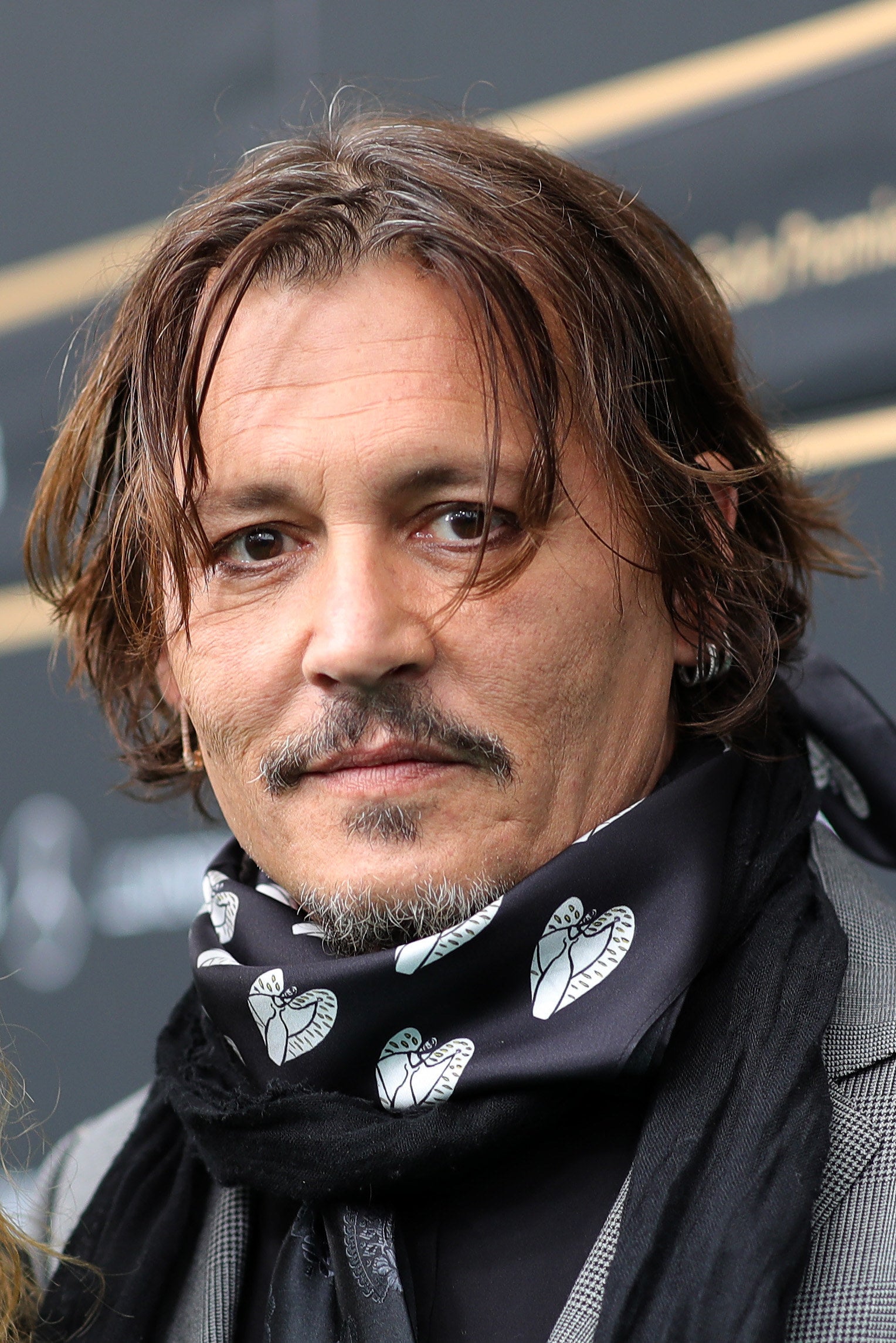 Depp looking into the camera and smiling