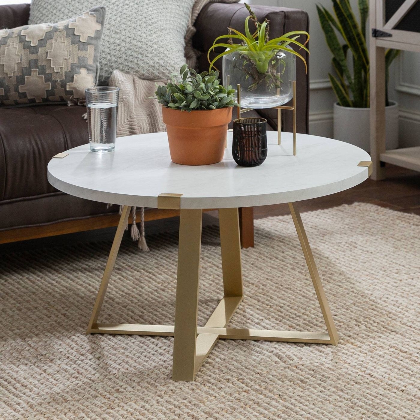 The table pictured in the faux white marble and gold finish