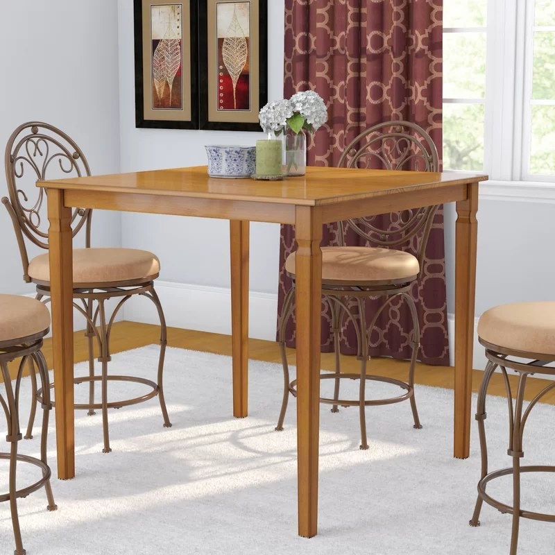 The table with four chairs around it