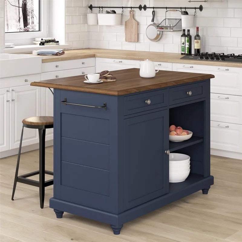 The island and stools in blue in a kitchen