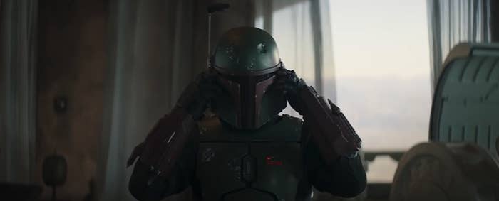 Boba Fett puts his helmet on