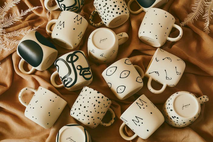 different ceramic mugs with black and white prints