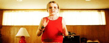 girl from little miss sunshine clasping her face