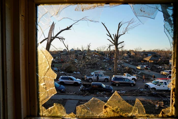 Wreckage from the tornado seen through a broken window