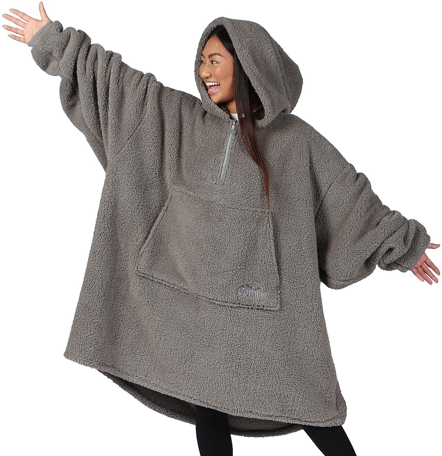 A person wearing an oversized hoodie