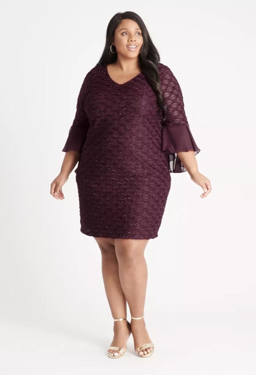 front view of model wearing the dress in aubergine
