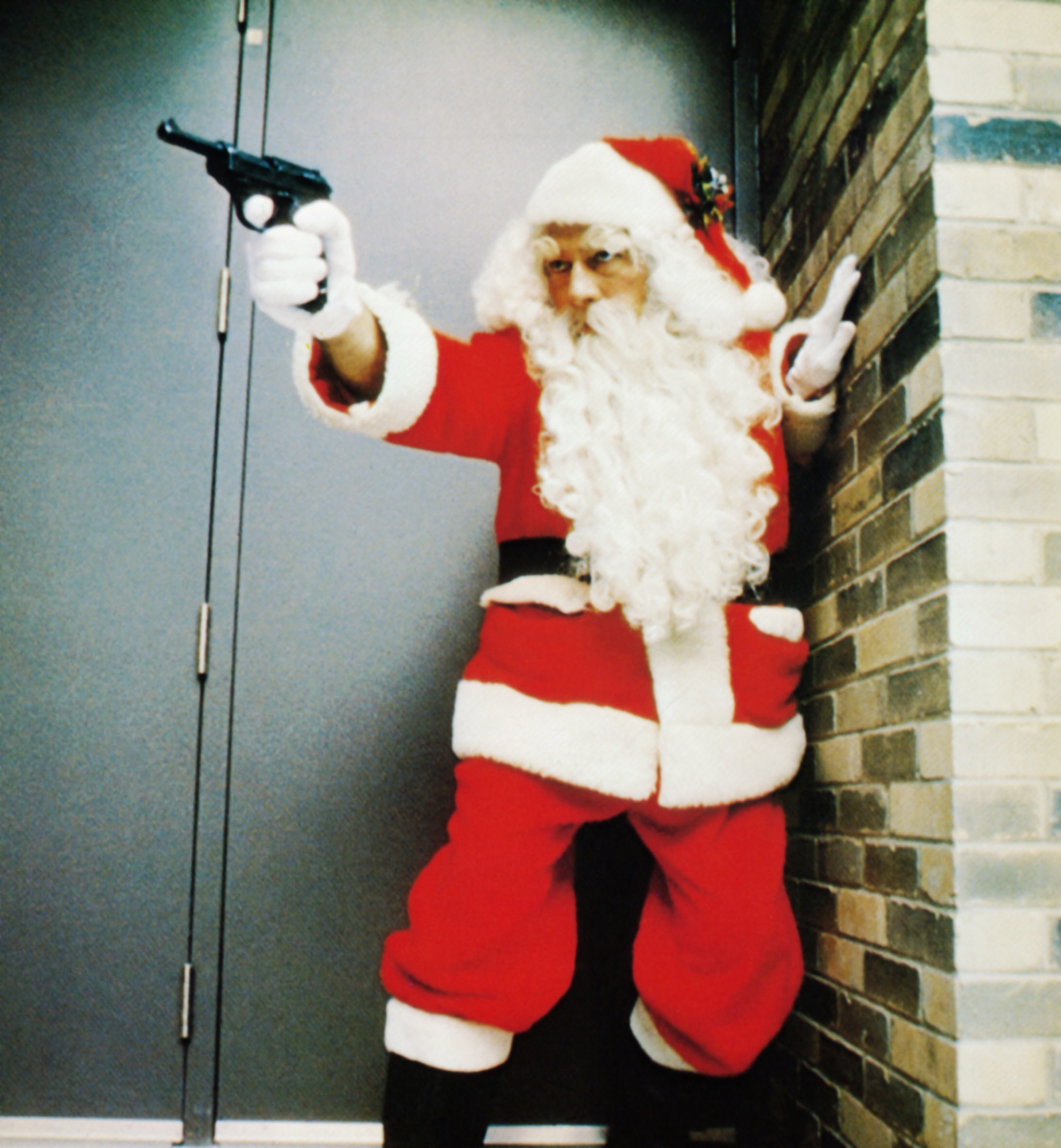 Harry Reikle (Christopher Plummer) dons a Santa suit and a pistol in &quot;The Silent Partner&quot;