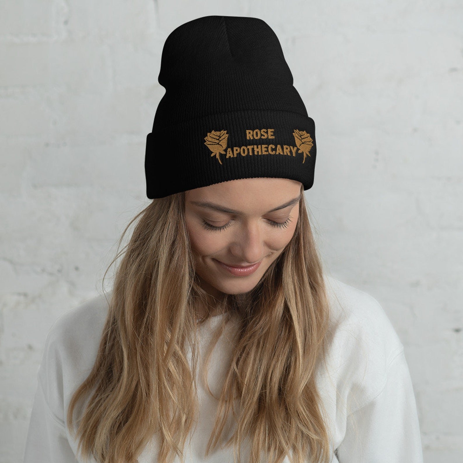 Model wearing the black Rose Apothecary beanie