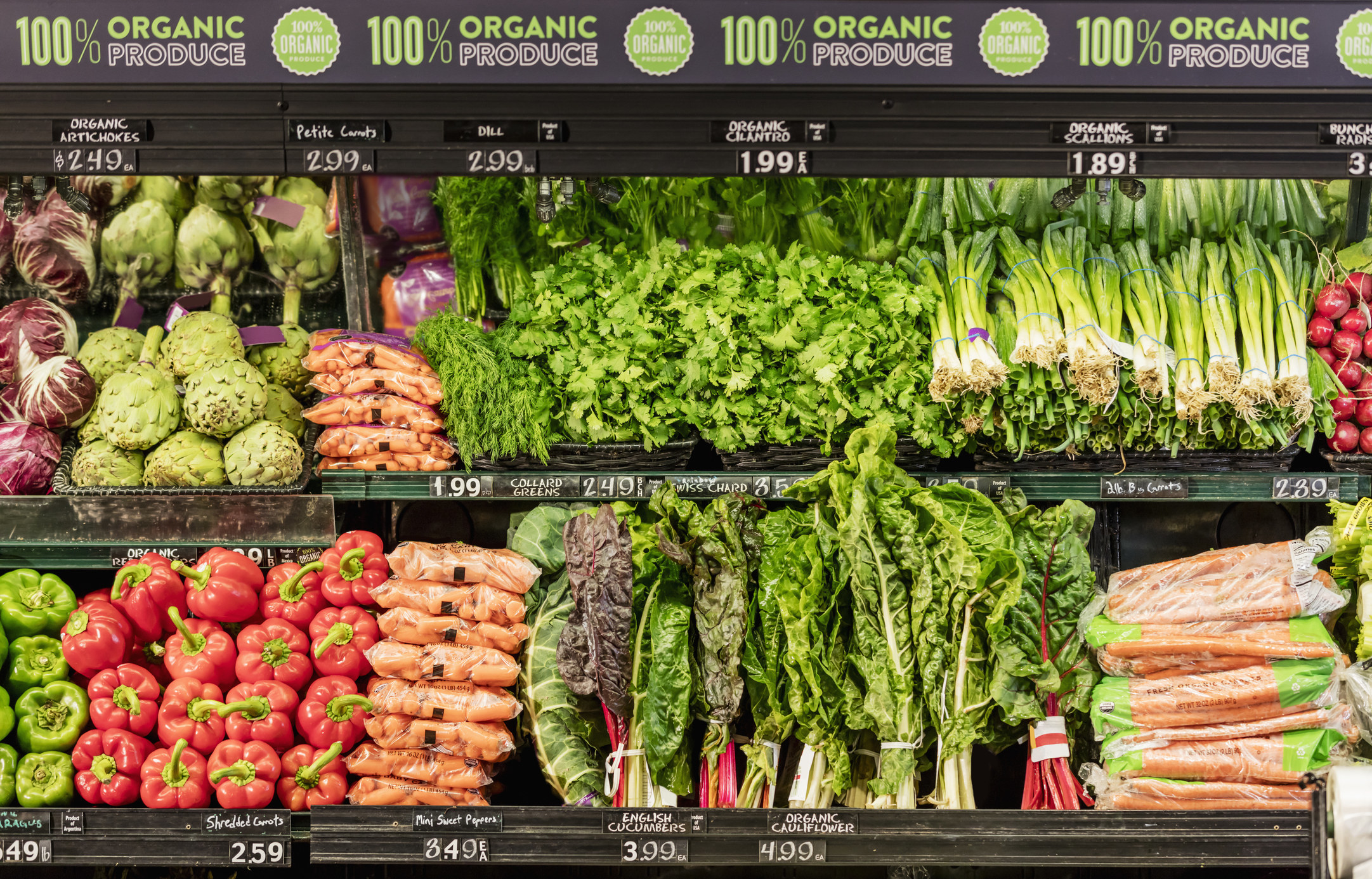Organic vegetables in the produce aisle of a supermarket