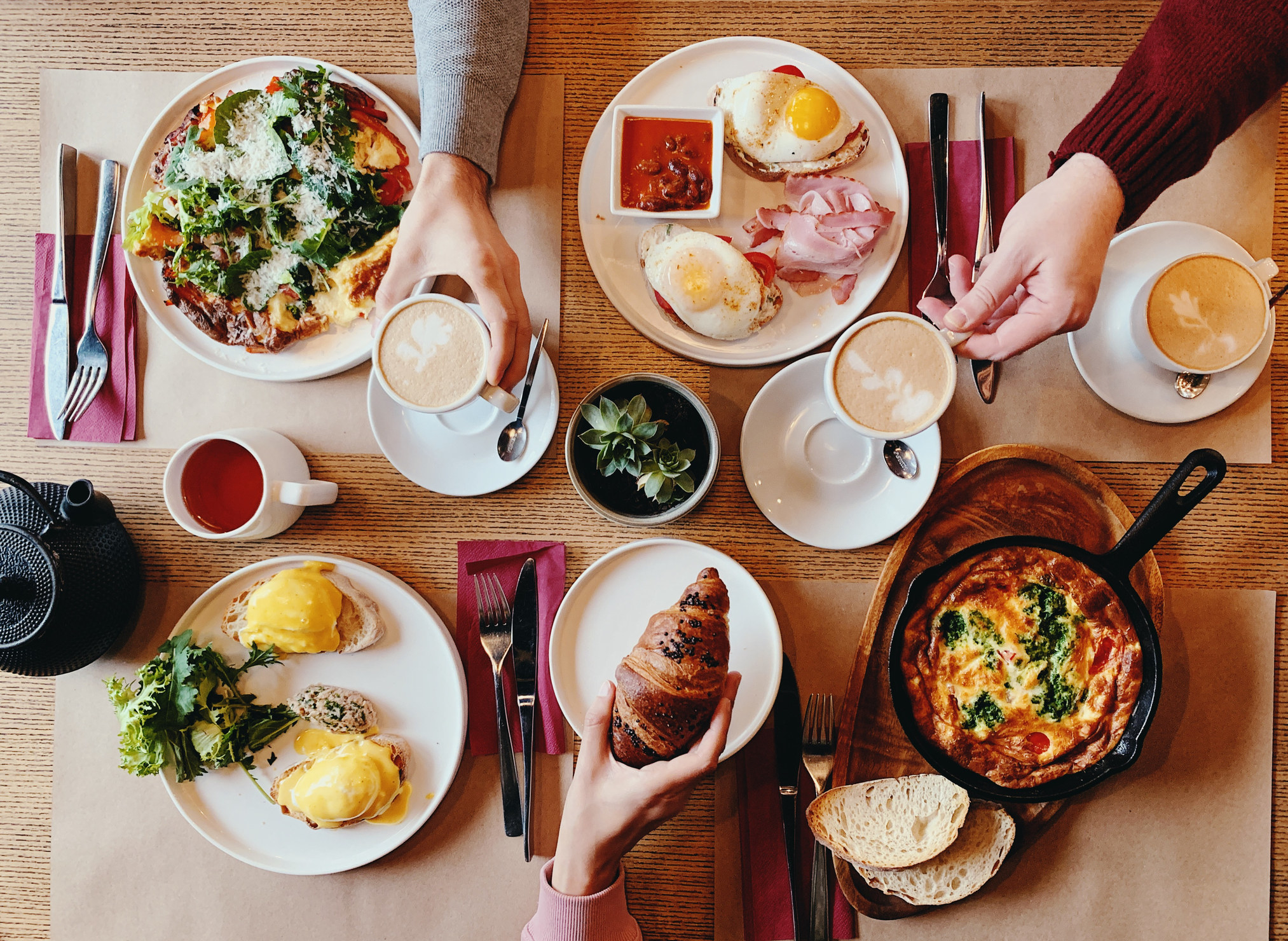 People eating breakfast at a table.