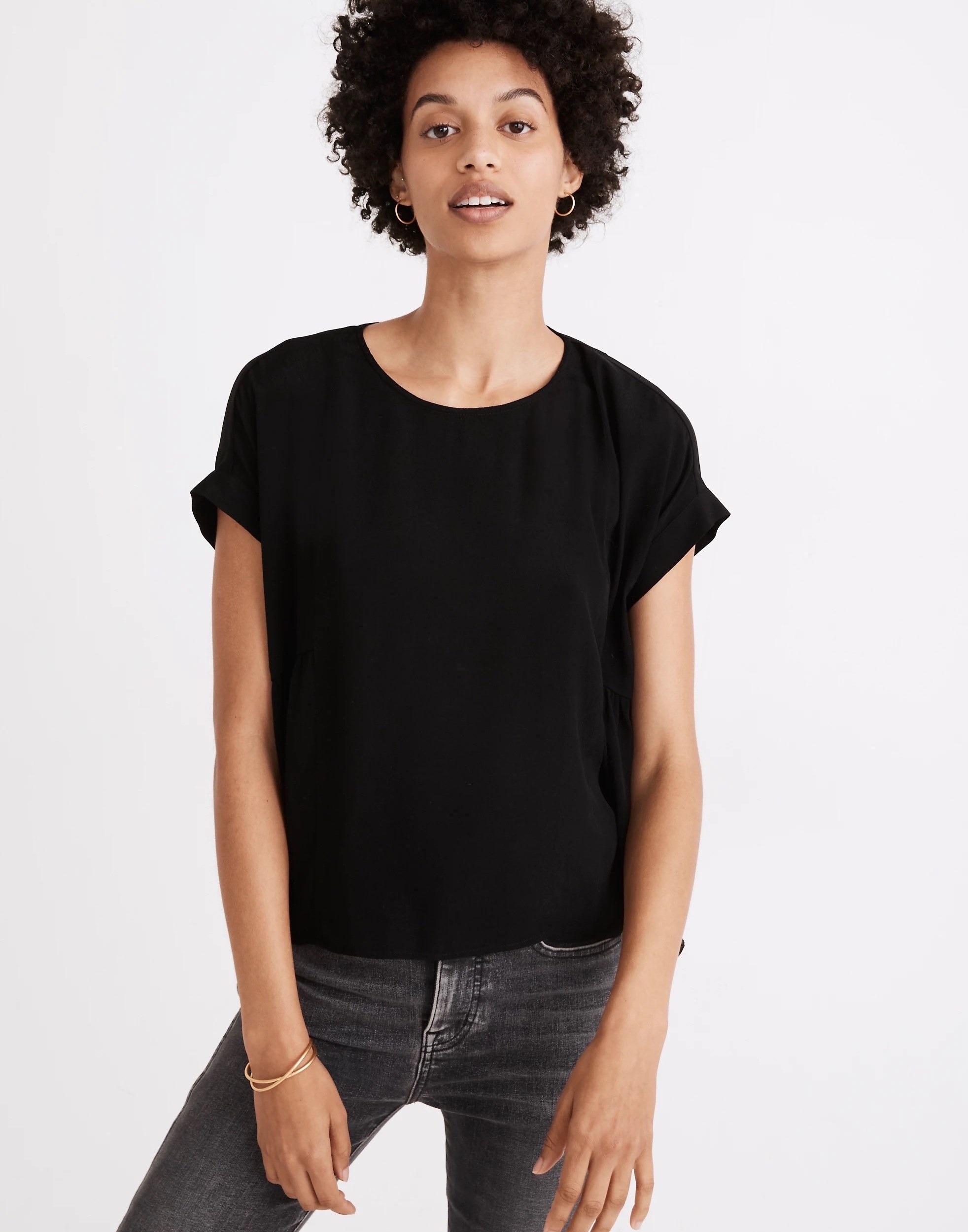 Model wearing black tee shirt with black jeans