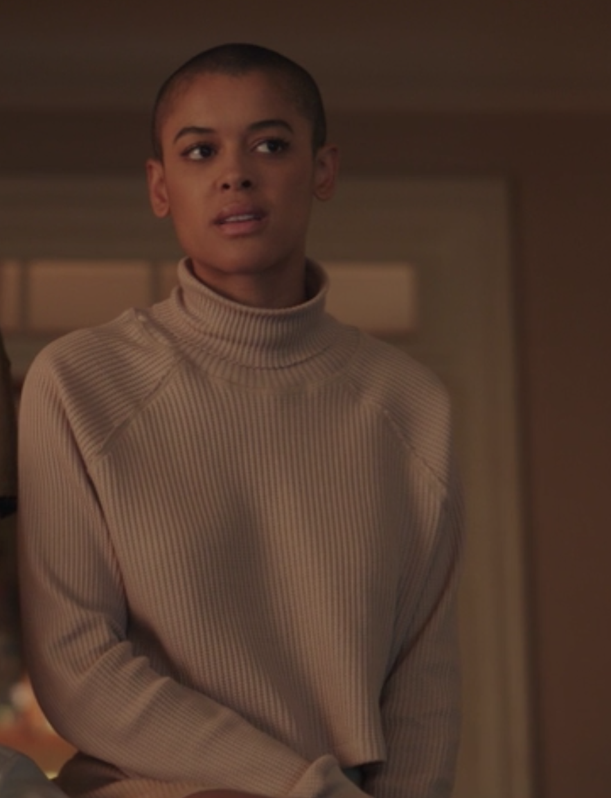 Julien Calloway wears a one color turtleneck and skirt set