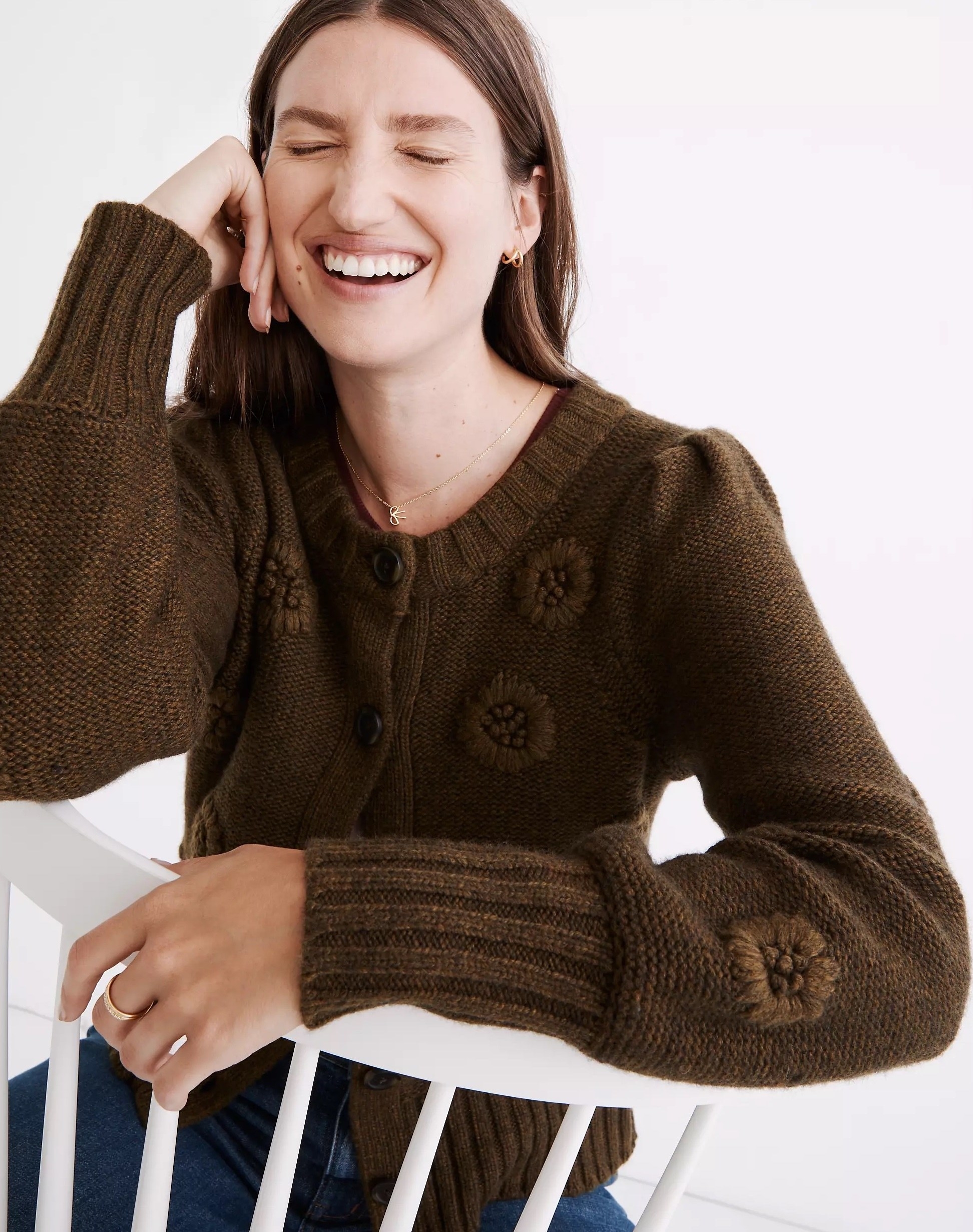 Model wearing brown cardigan with jeans