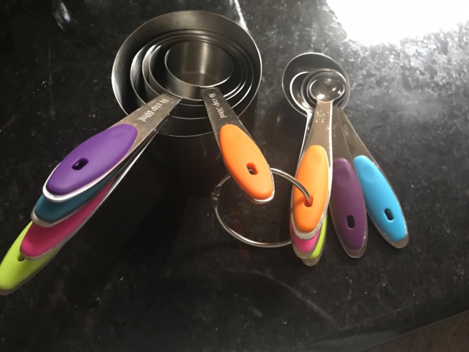 the set of 12 Kitchen Measuring Cups and Spoons on a kitchen counter