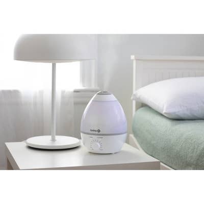 the Safety humidifier emitting steam on a bedside table