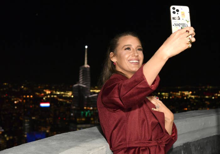 Blake taking a selfie on a rooftop at night
