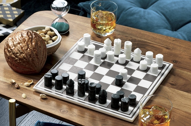 The small square black and white checkered board with black and white marble pieces