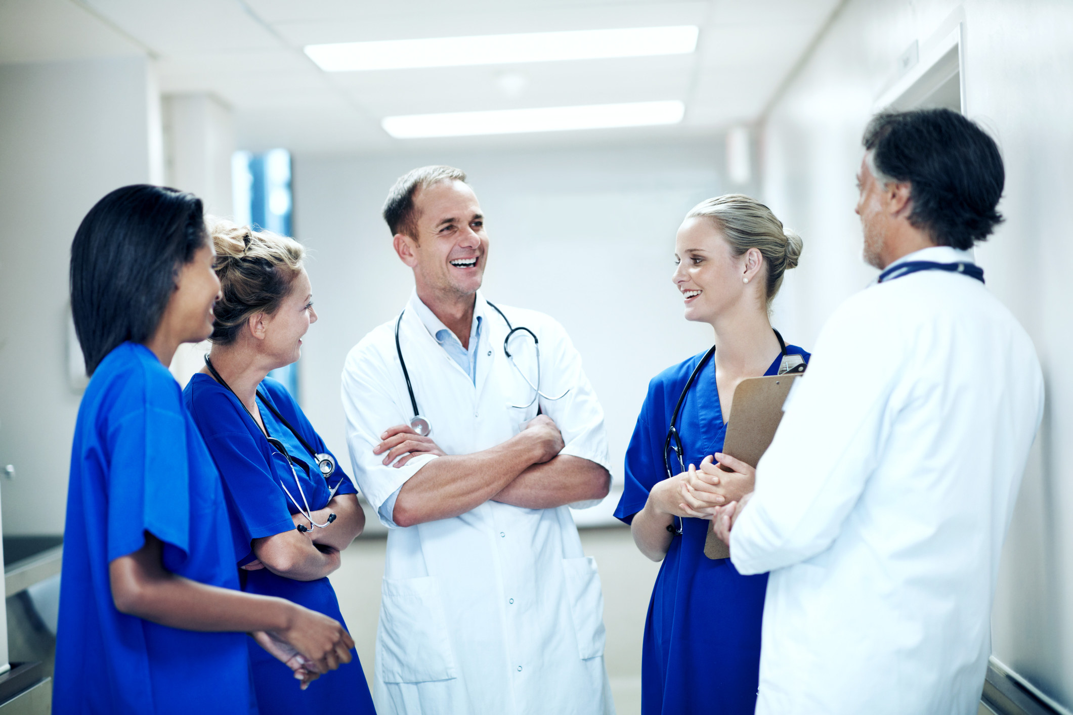 Doctor laughing with colleagues