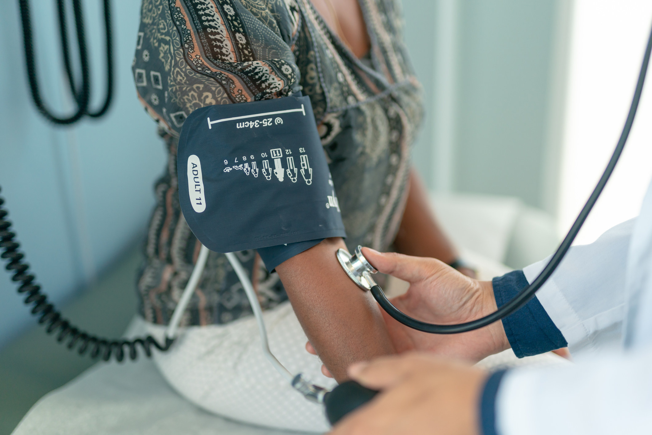 Woman getting her blood pressure checked