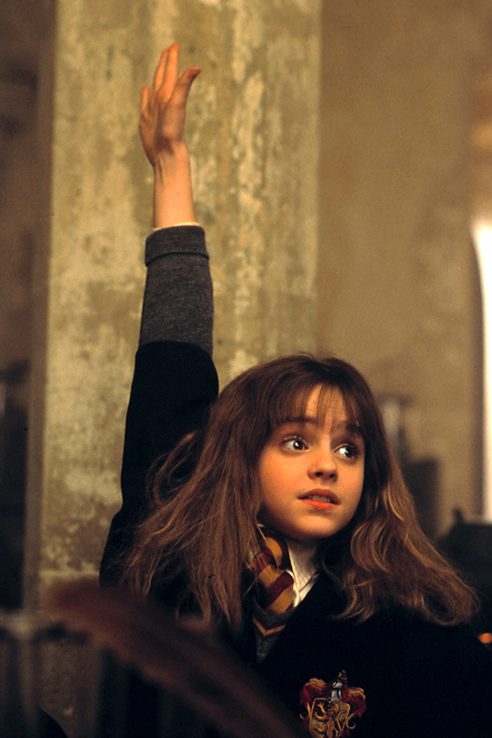 Hermione raises her hand in class excitedly