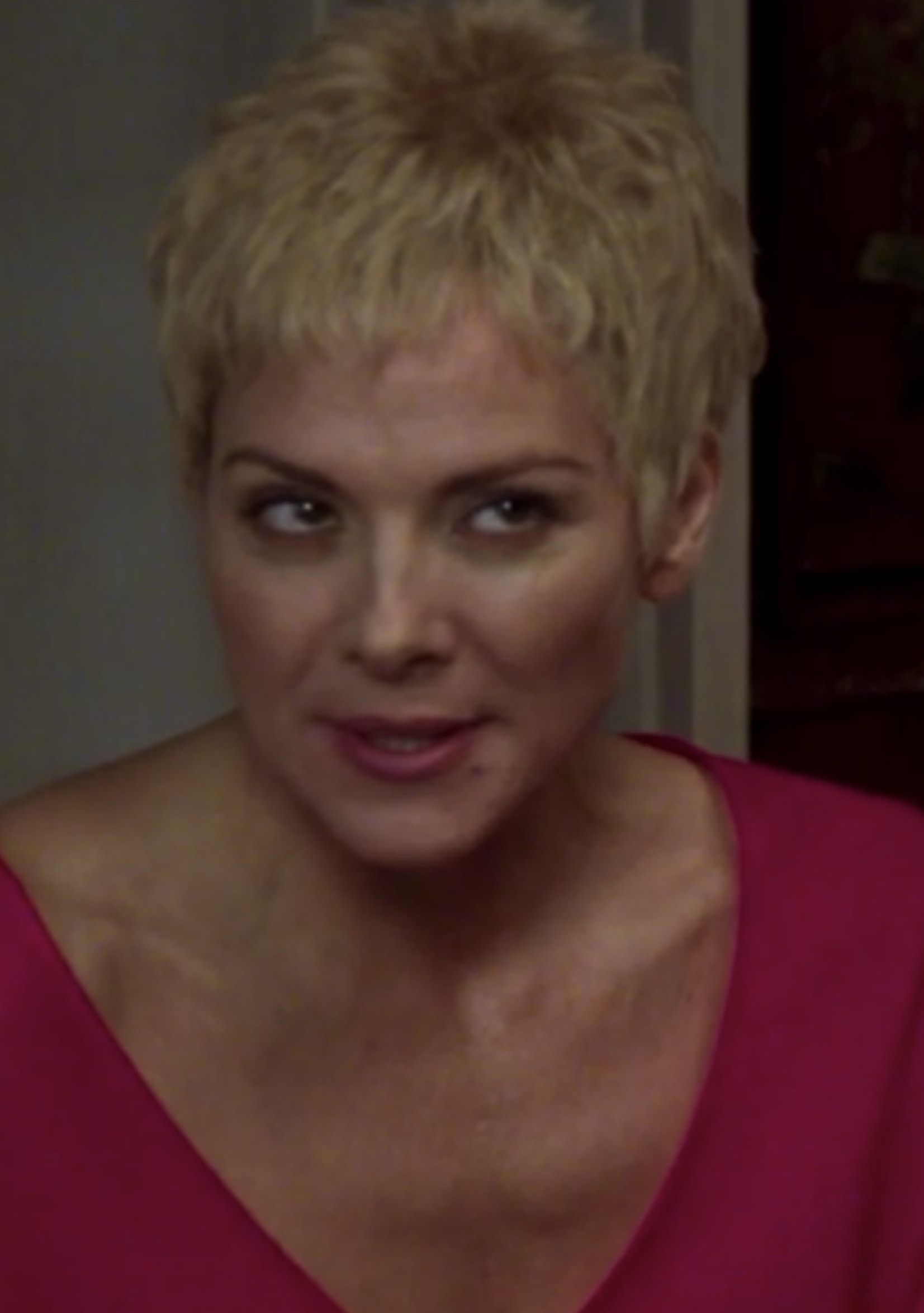 Cattrall with very short hair, as Samantha had cancer in the series finale