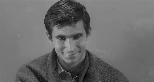 Norman Bates staring at the screen with his mother&#x27;s corpse superimposed over his face in &quot;Psycho&quot; (1960)