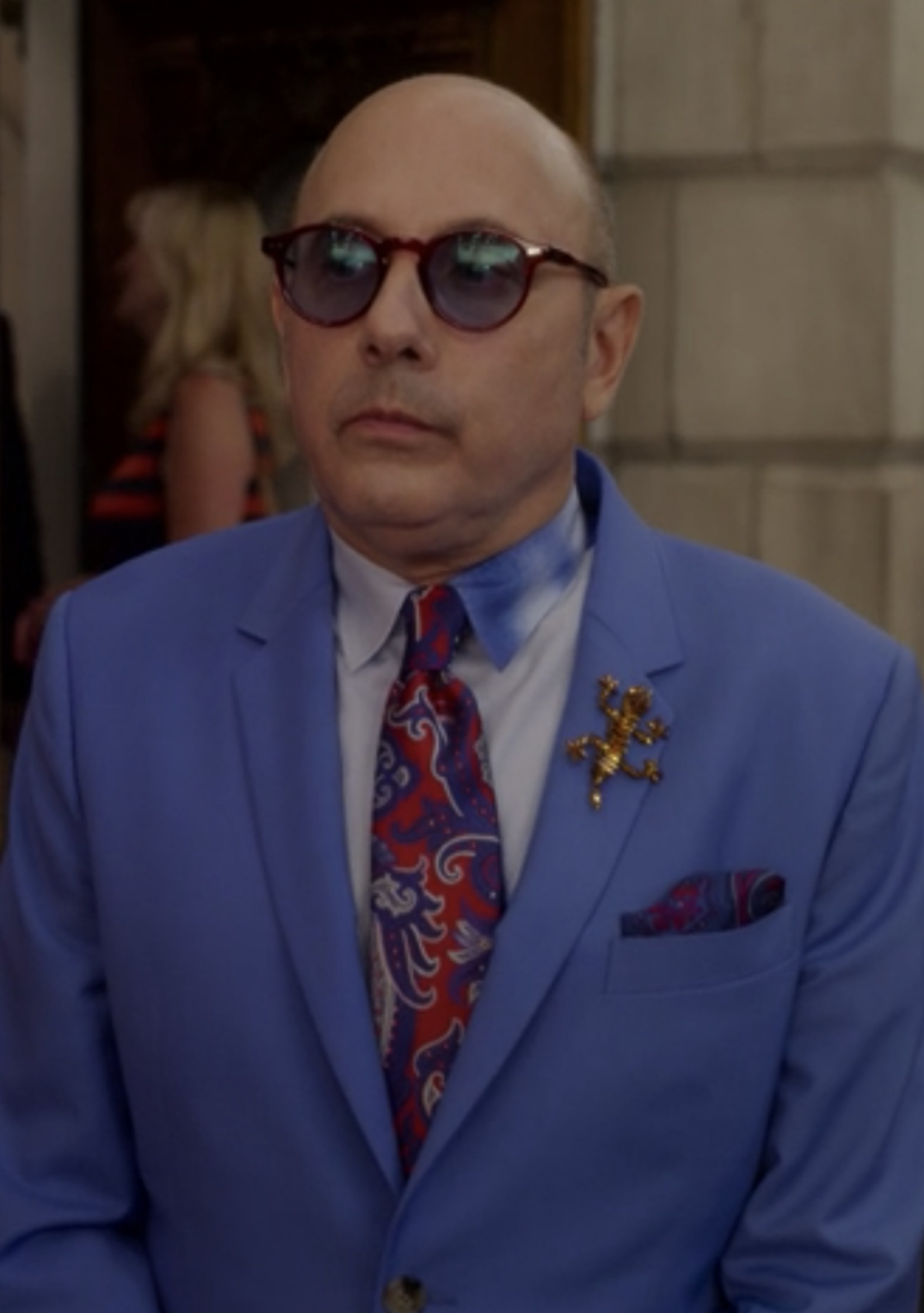 Garson wearing a bright-colored suit and glasses at Lily&#x27;s piano recital
