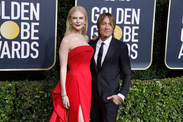 Nicole Kidman and Keith Urban posing on the Golden Globes step-and-repeat
