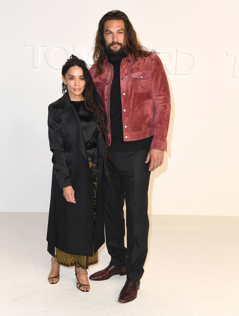 Lisa Bonet and Jason Momoa posing at the Tom Ford fashion show