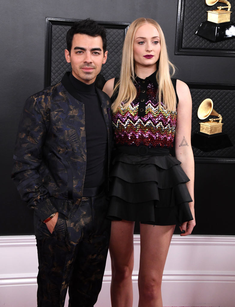 Joe Jonas and Sophie Turner posing on the Grammys red carpet