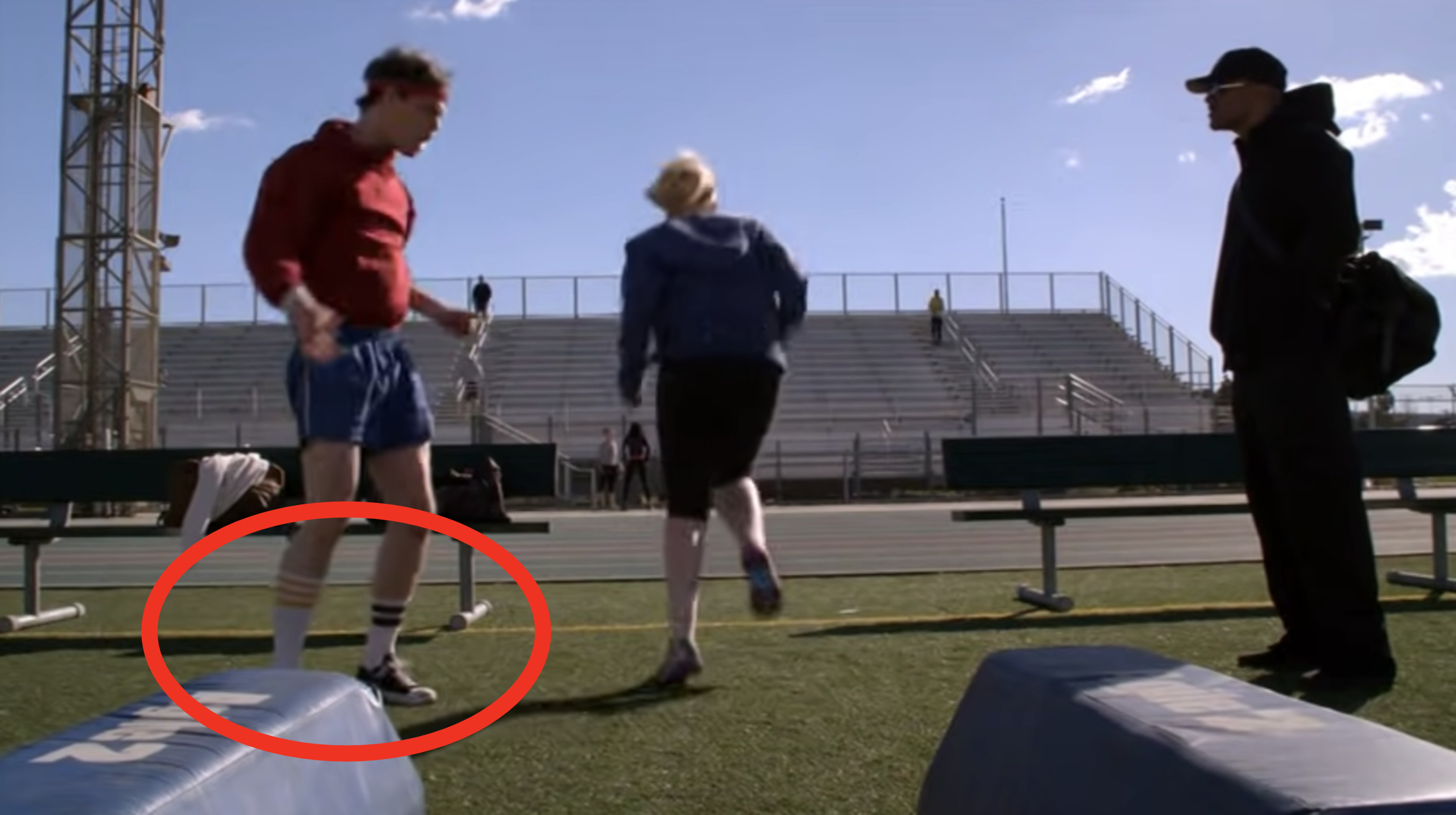 Spencer wearing mismatching socks in a scene