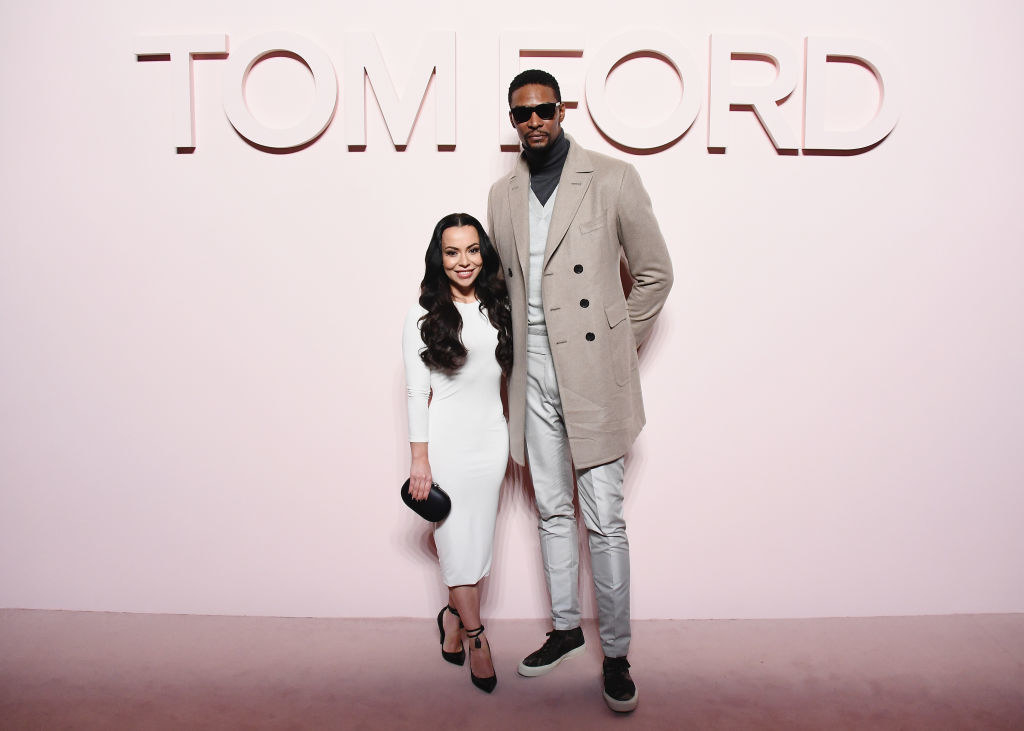 Chris Bosh and Adrienne Williams posing at the Tom Ford fashion show