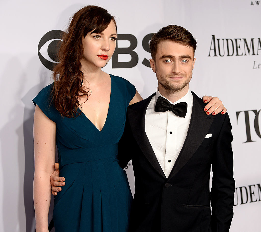 Erin Darke and Daniel Radcliffe posing on a red carpet