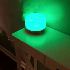 a reviewers diffuser in use with the green and blue light transitioning