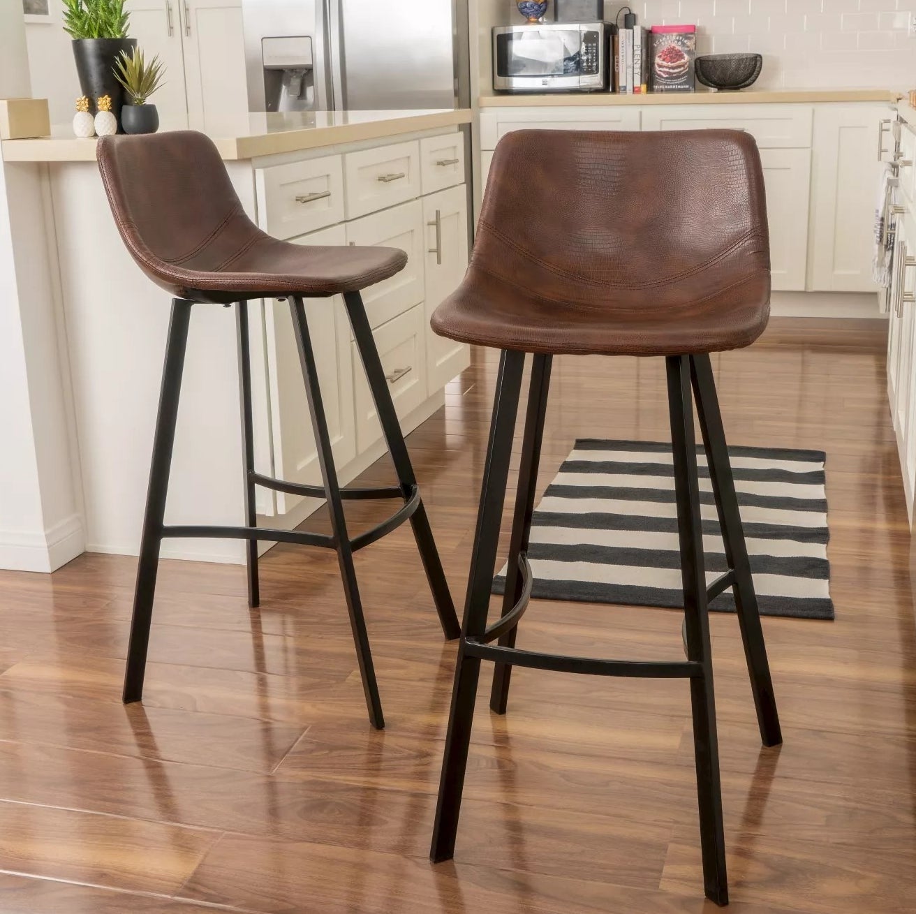 The brown and black barstools