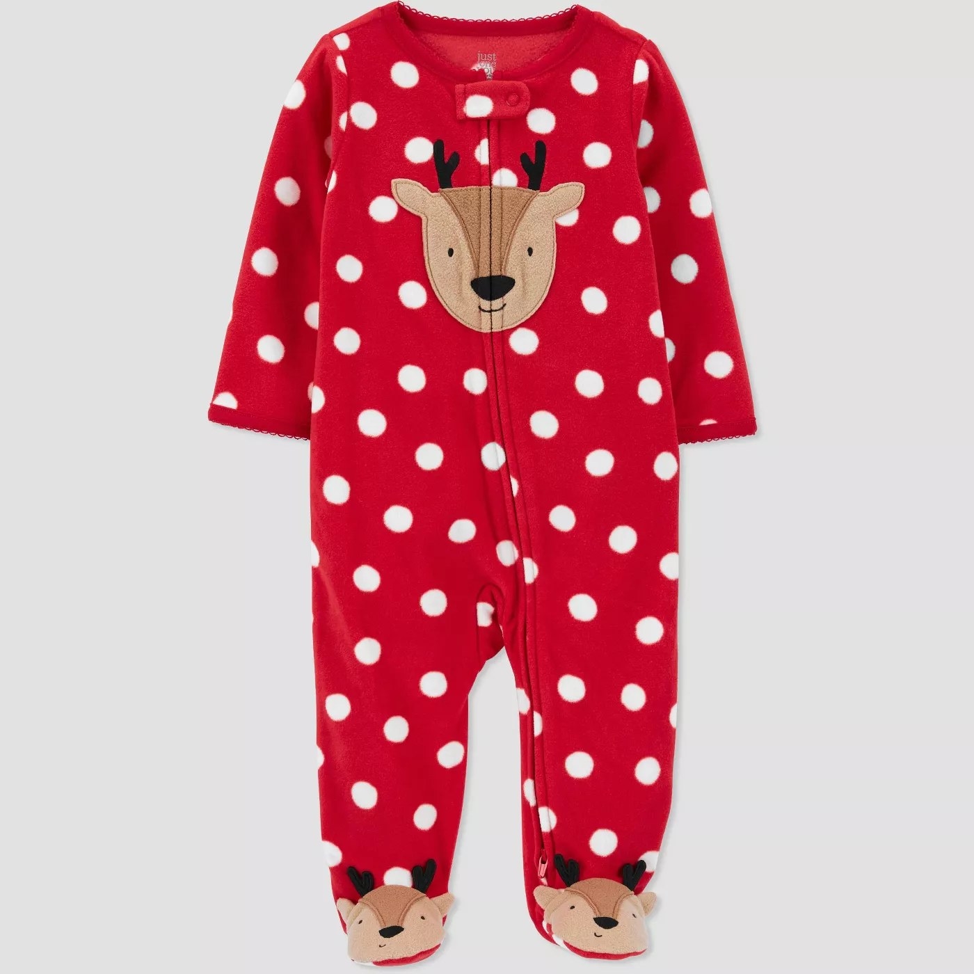 Red pajamas with white spots and reindeers on the chest and feet