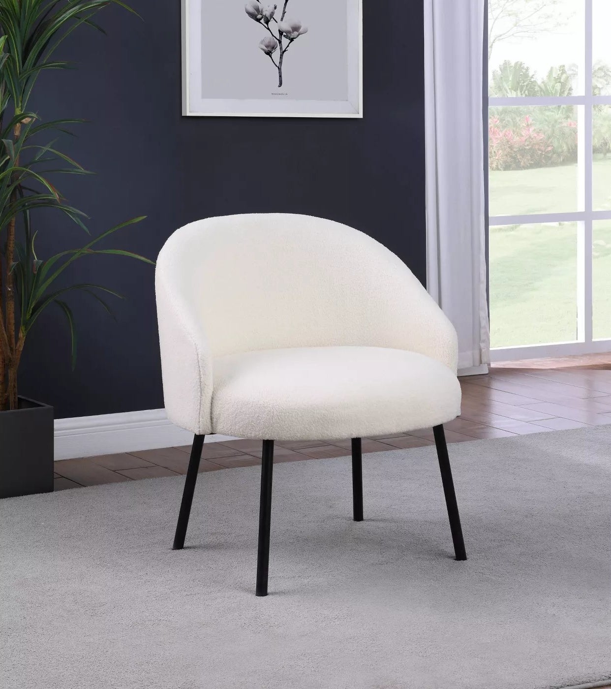 The white chair with black legs