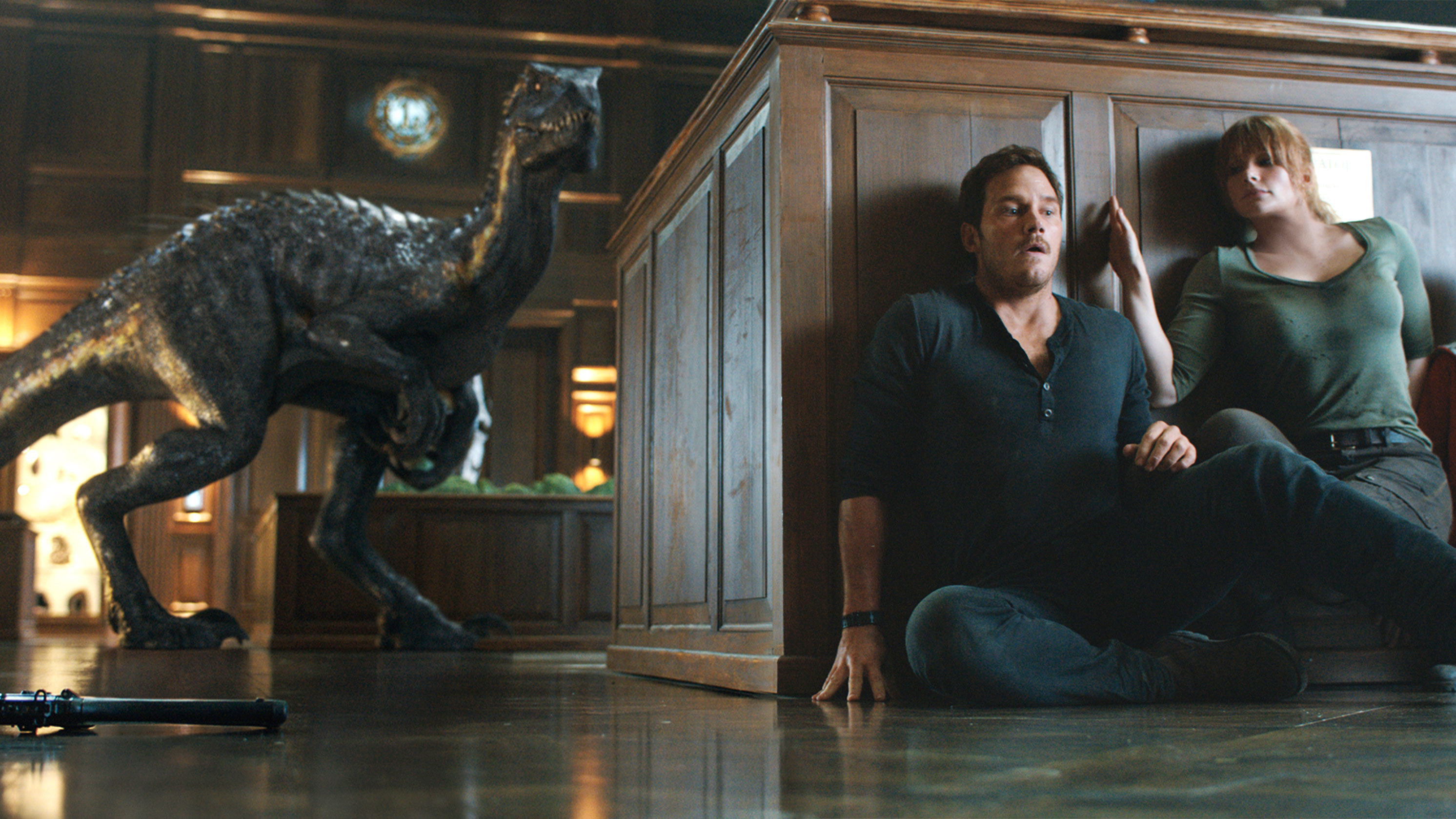 chris pratt as owen and bryce dallas howard as claire hide from a velociraptor