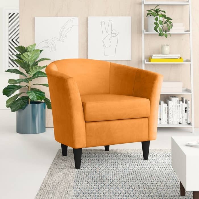 the orange chair in a decorated room