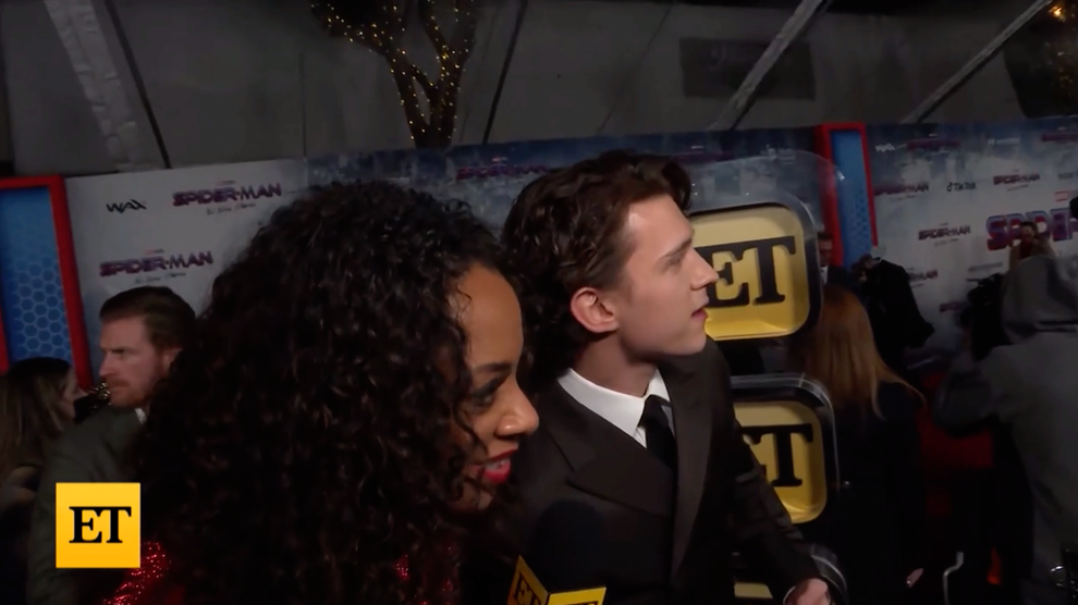 Tom Holland Stops Interview To Watch Zendaya Arrive At "Spider-Man: No