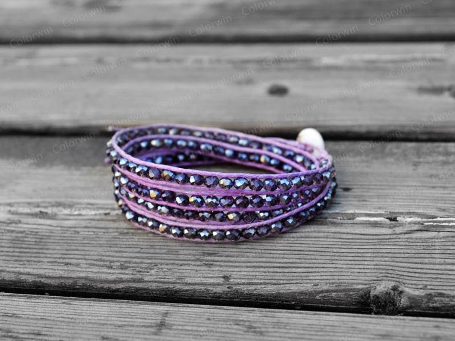 A purple beaded wrap bracelet.