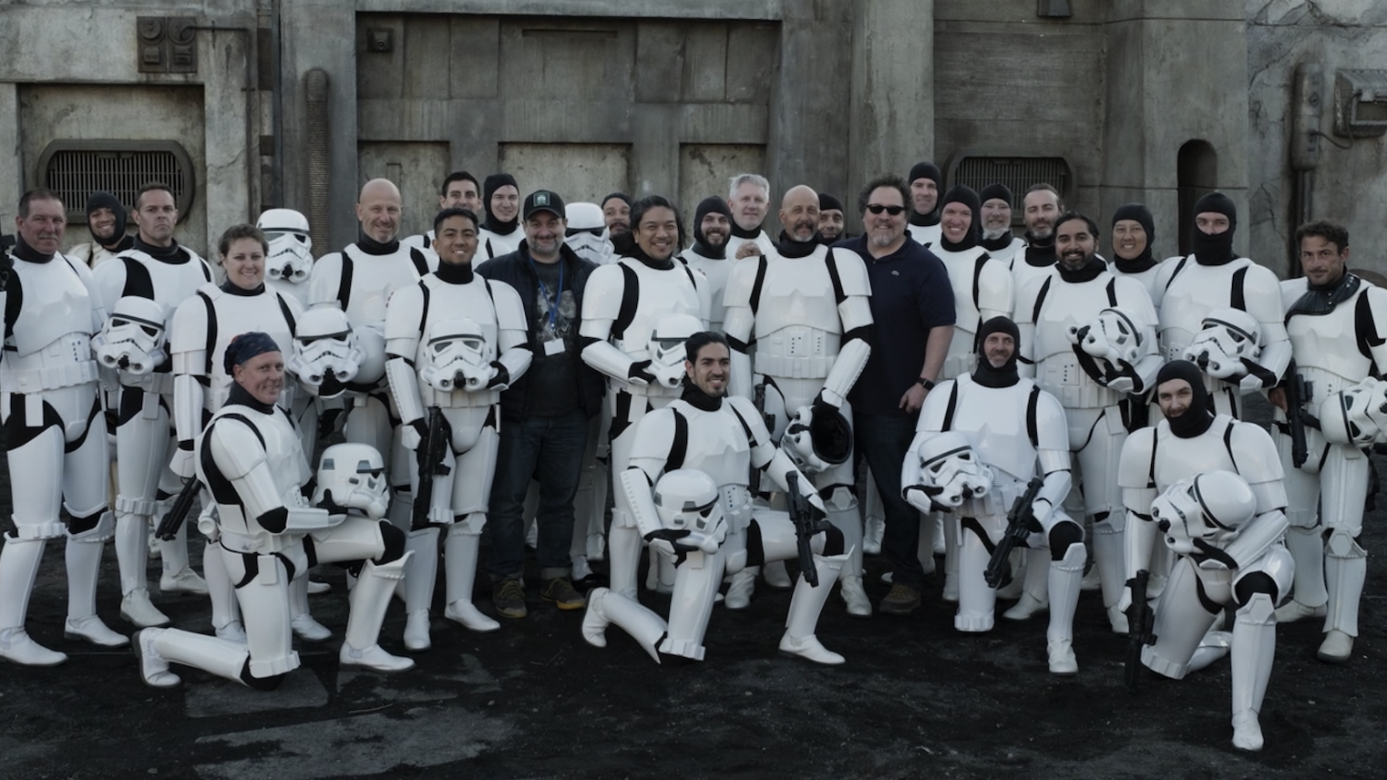 The 501st taking a photo with Jon Favreau and some other crew members