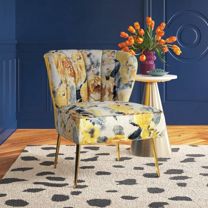 the blue and yellow floral chair in a decorated room